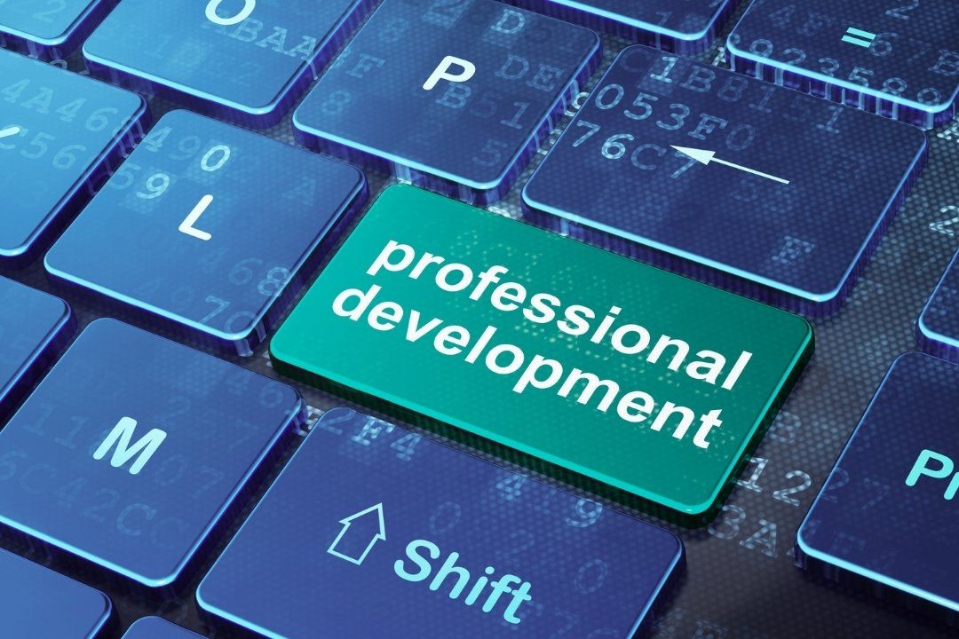 Professional development icon on keyboard in blue and aqua
