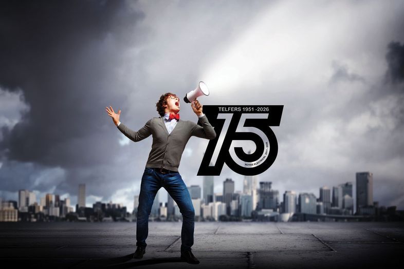 Man shouting into a megaphone next to the Telfers 75 years logo