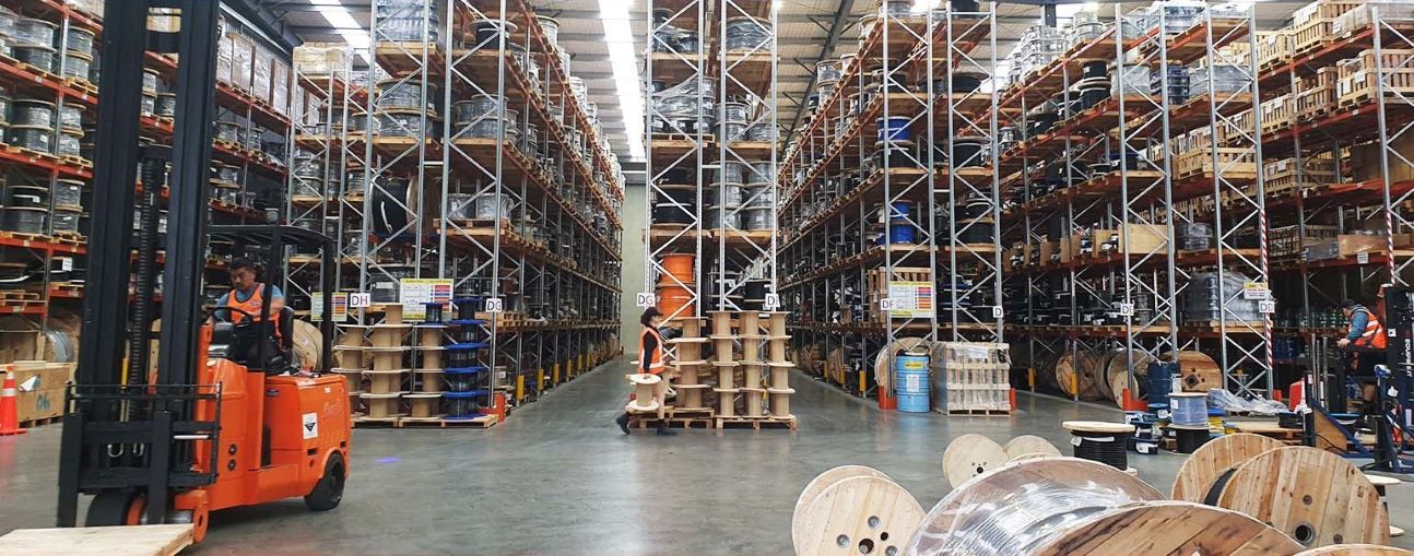 Cable warehouse with forklift driver and spools